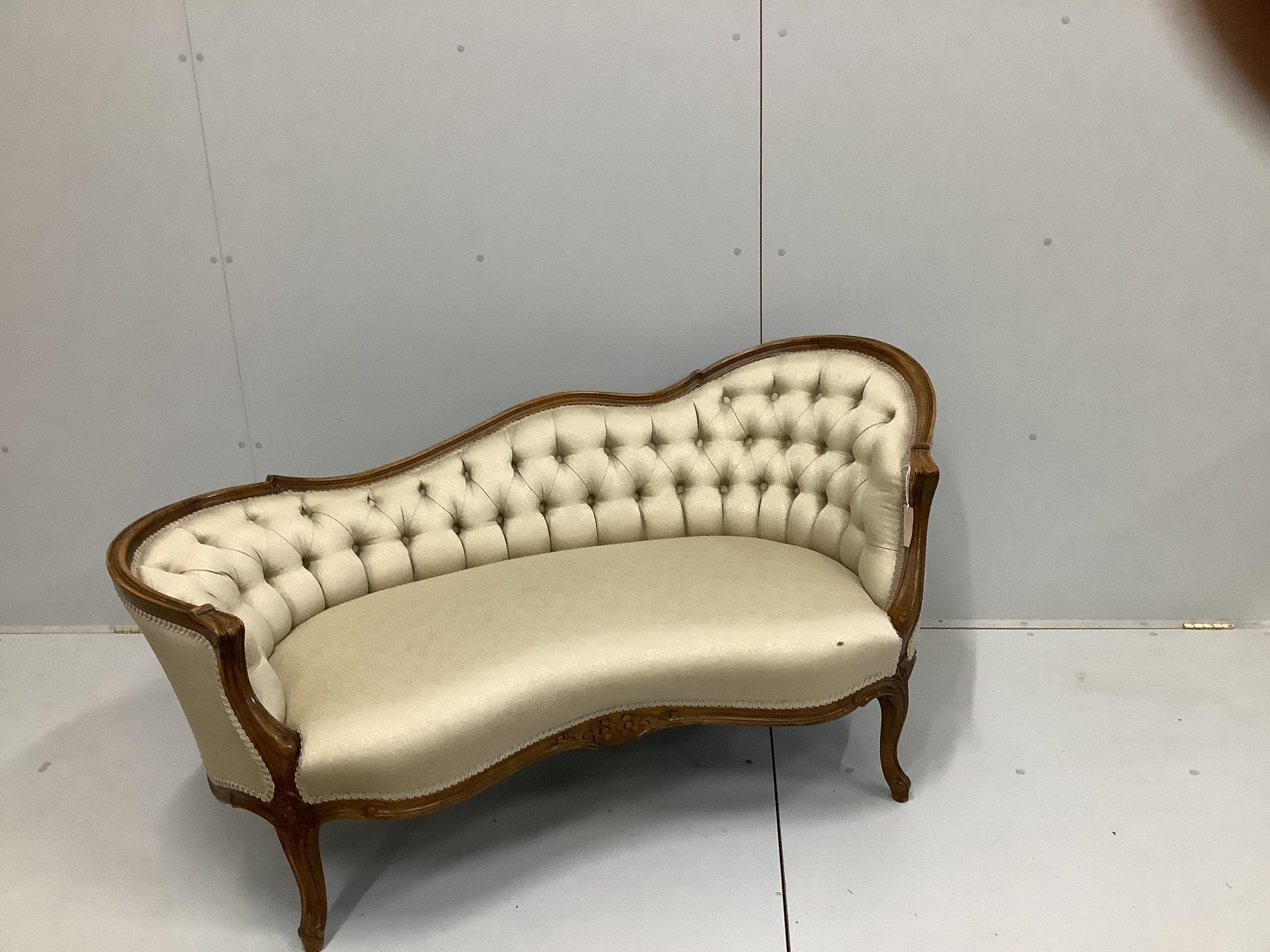 An early 20th century Louis XVI style beech button back show-wood couch, with carved and moulded frame, on cabriole legs, width 151cm, depth 70cm, height 73cm
